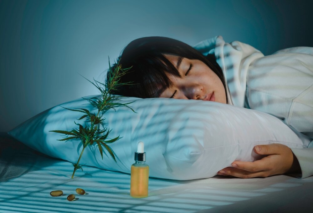 Cannabis and Sleep. Asian Girl Sleeping In Evening Bedroom With Cbd Oil Capsules.